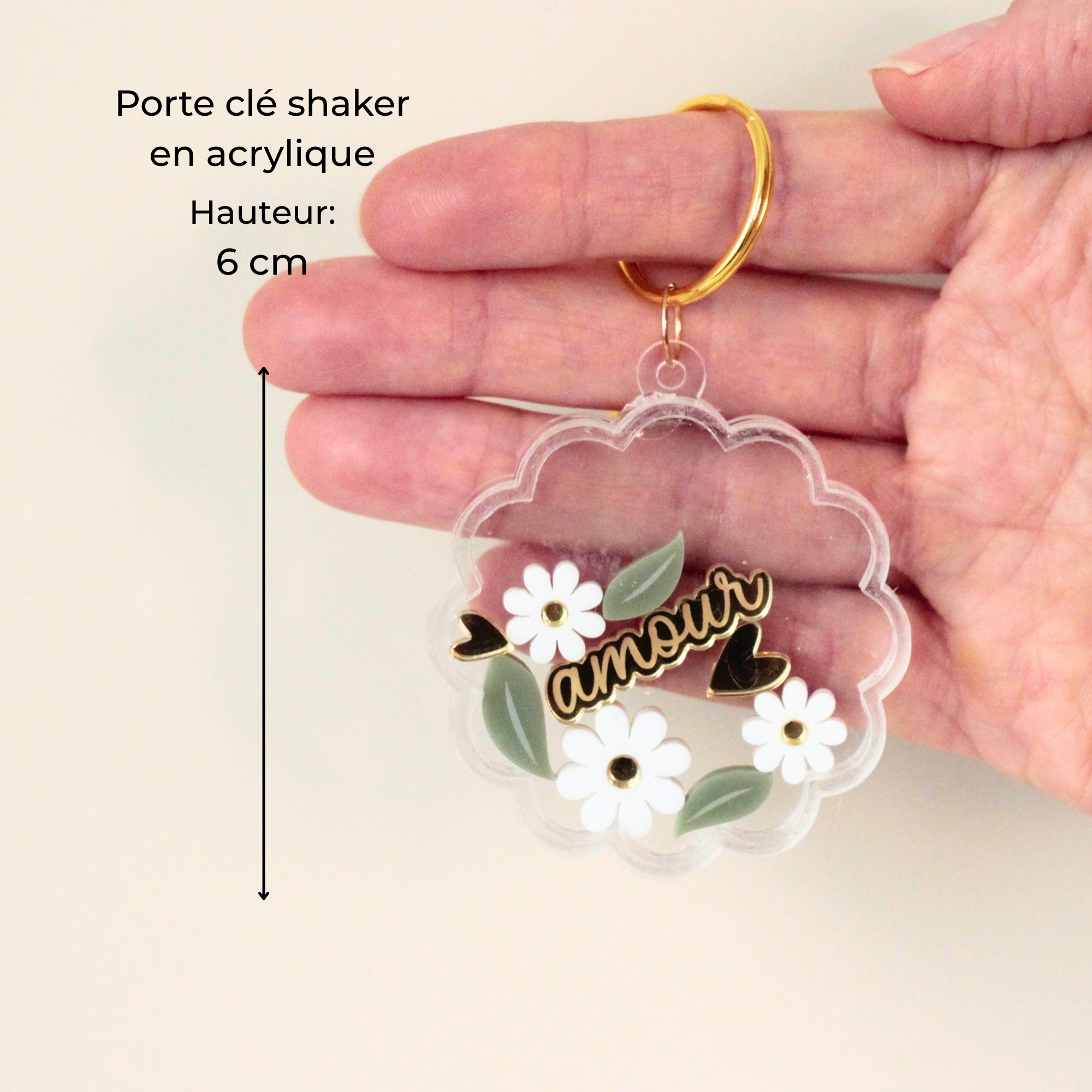 Porte-clé shaker marguerite personnalisé tenu à la main